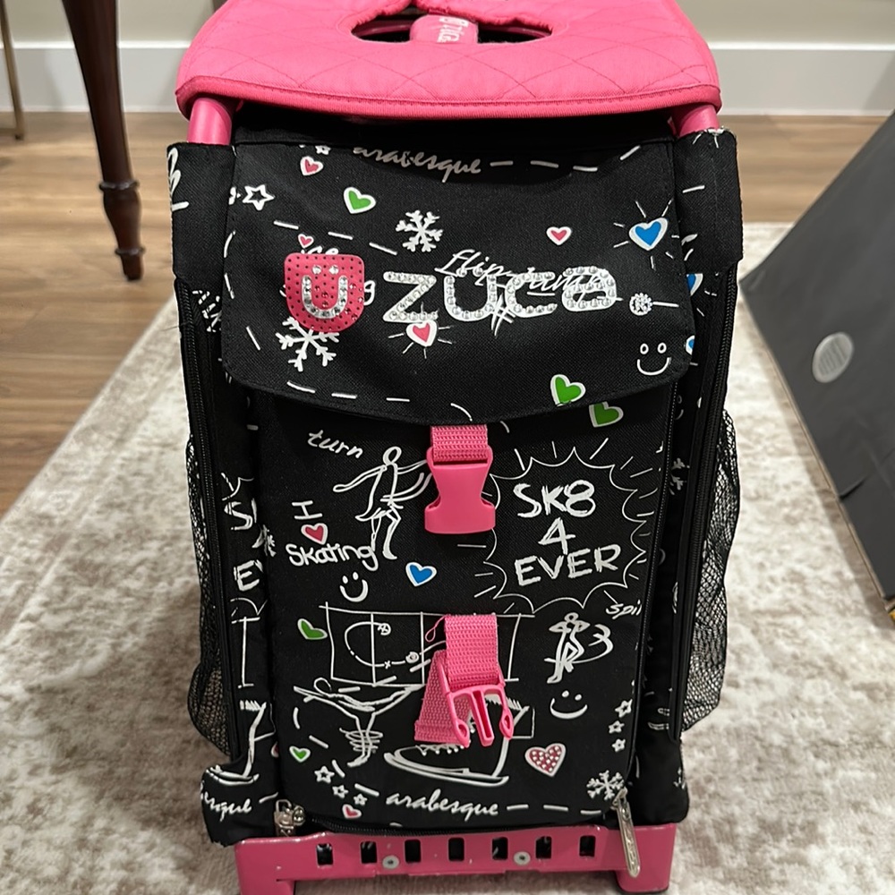 Zuca roller bag with 2 covers. One black print the other pink